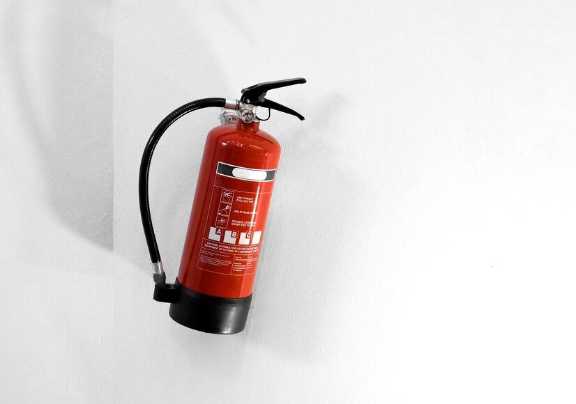 red-fire-extinguisher-white-wall_53876-100096.jpg