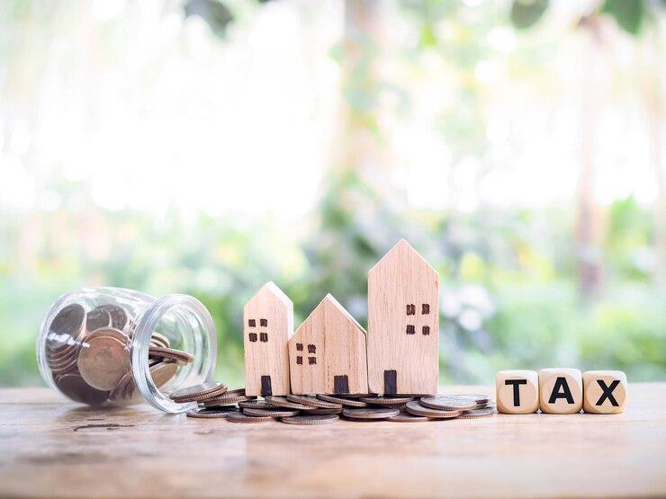 house-coins-wooden-blocks-with-word-tax-concept-paying-tax-house-property_42299-877.jpg