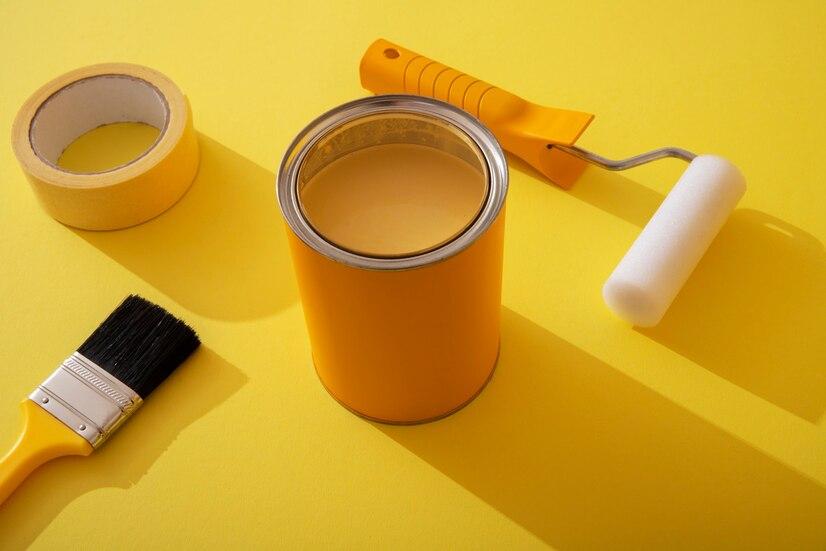 assortment-painting-items-with-yellow-paint_23-2149580011.jpg