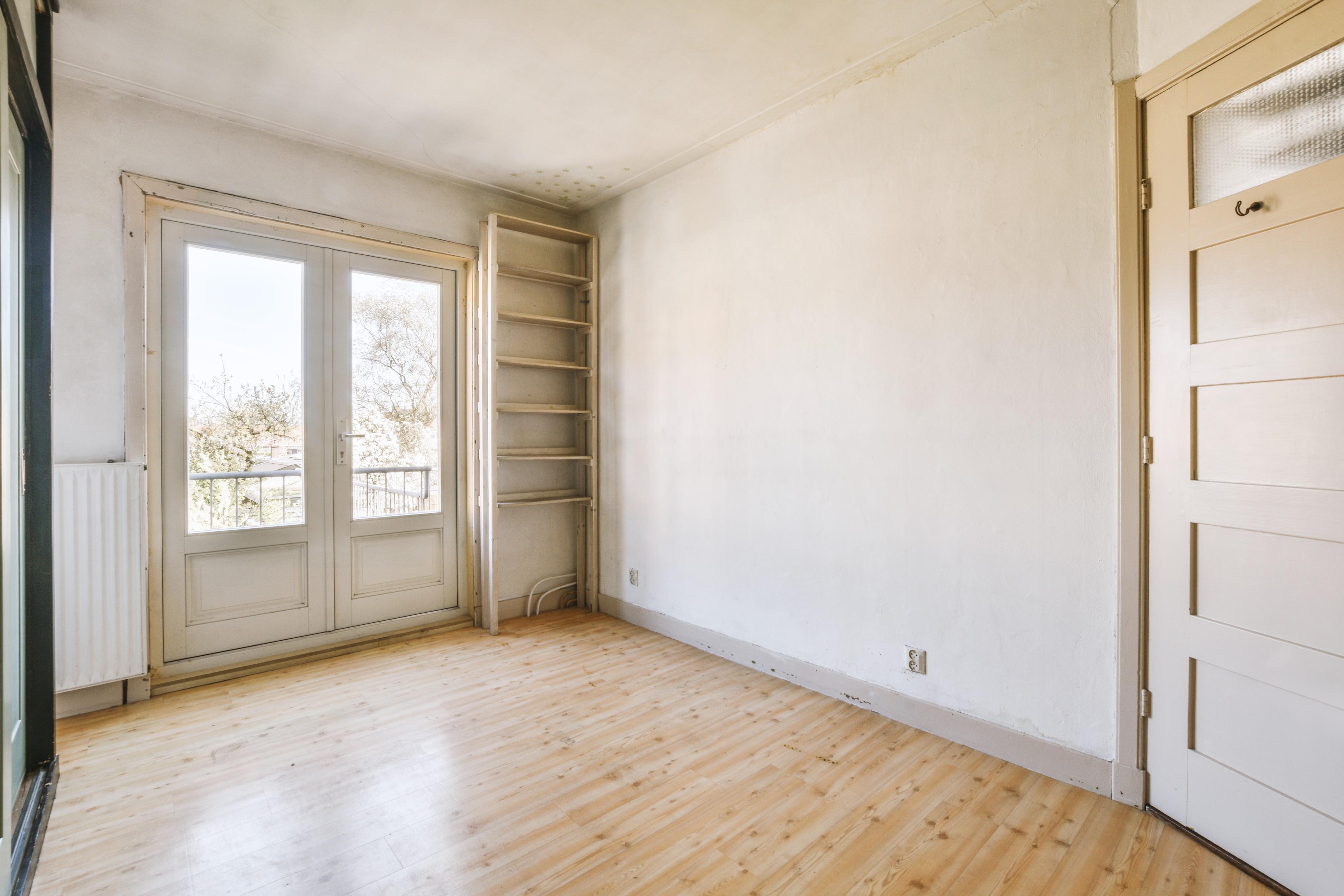 empty-living-room-with-white-walls-wooden-floors (1) (1).jpg